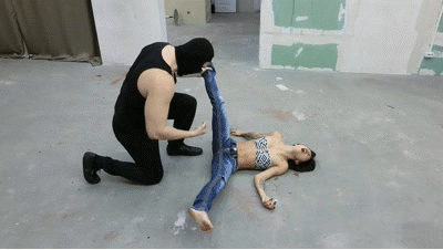 The robber destroys Tiffany with low blows The robber destroys Tiffany with low blows